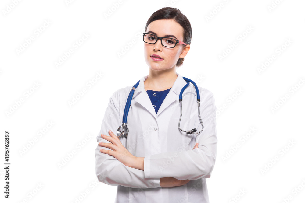 Young woman doctor with crossed arms with stethoscope in white uniform on white background Young woman doctor with crossed arms with stethoscope in white uniform on white background