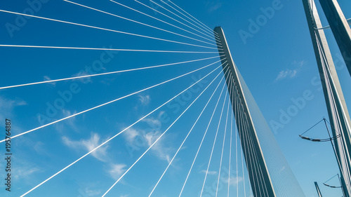 Fototapeta Naklejka Na Ścianę i Meble -  Close up of cable stayed bridge against blue sky