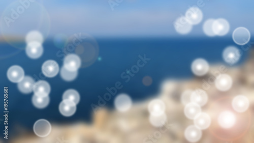 Abstract bokeh lights on blue backround from sea and sky
