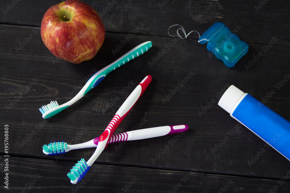 Accessories for personal hygiene. Four brush, floss and toothpaste Accessories for personal hygiene. Four brush, floss and toothpaste