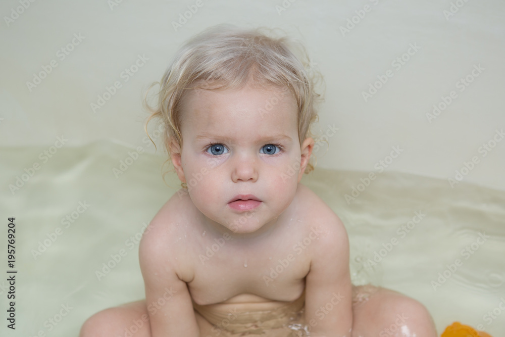 little girl brushes teeth
