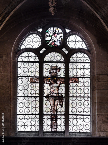  Jesus on the cross painted on the glass of a window inside the church of St. Stephen's of the Mount in Paris.