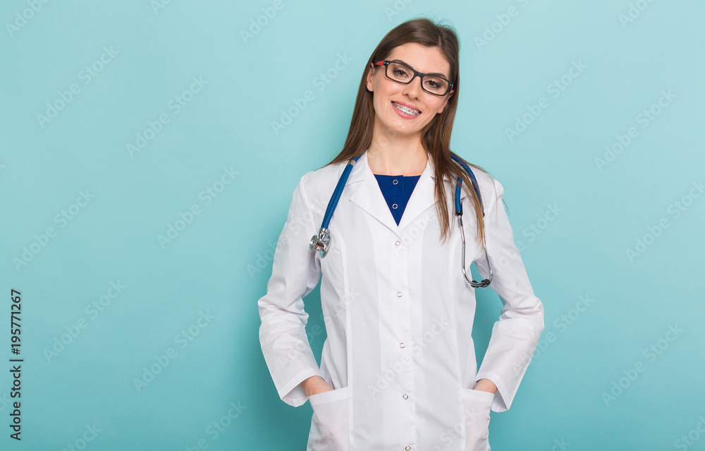 Attractive female doctor in white coat and glasses Attractive female doctor in white coat and glasses