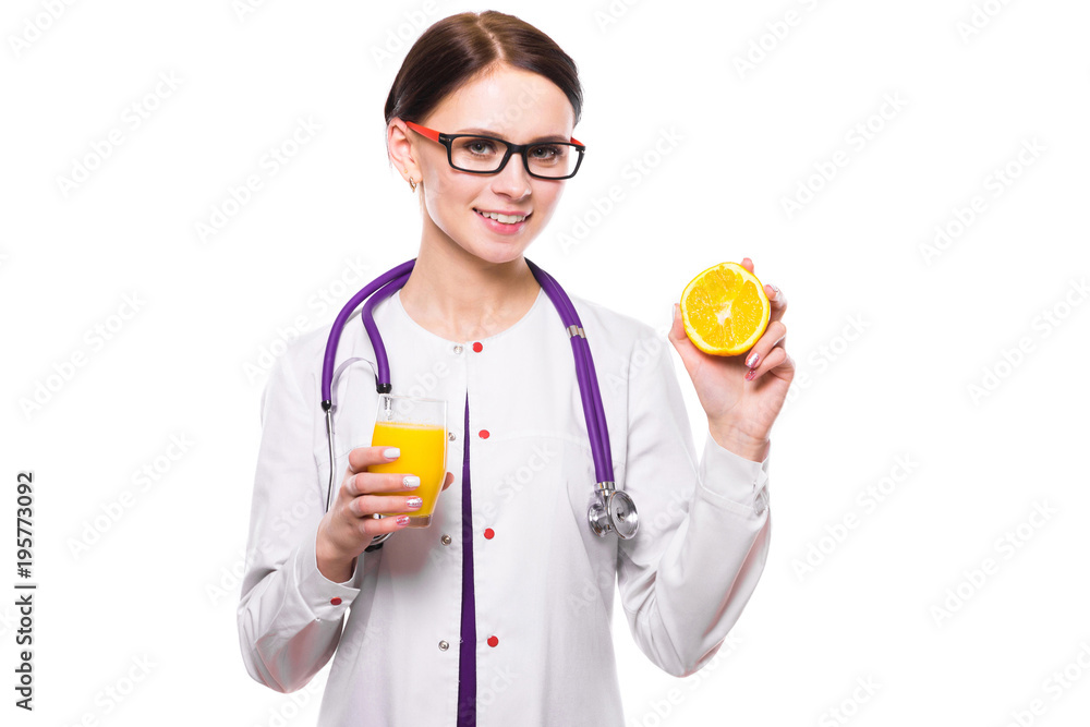Female nutritionist hold orange in section and glass of fresh juice in her hands on white background Female nutritionist hold orange in section and glass of fresh juice in her hands on white background