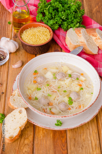 Chicken soup with meatballs and noodles