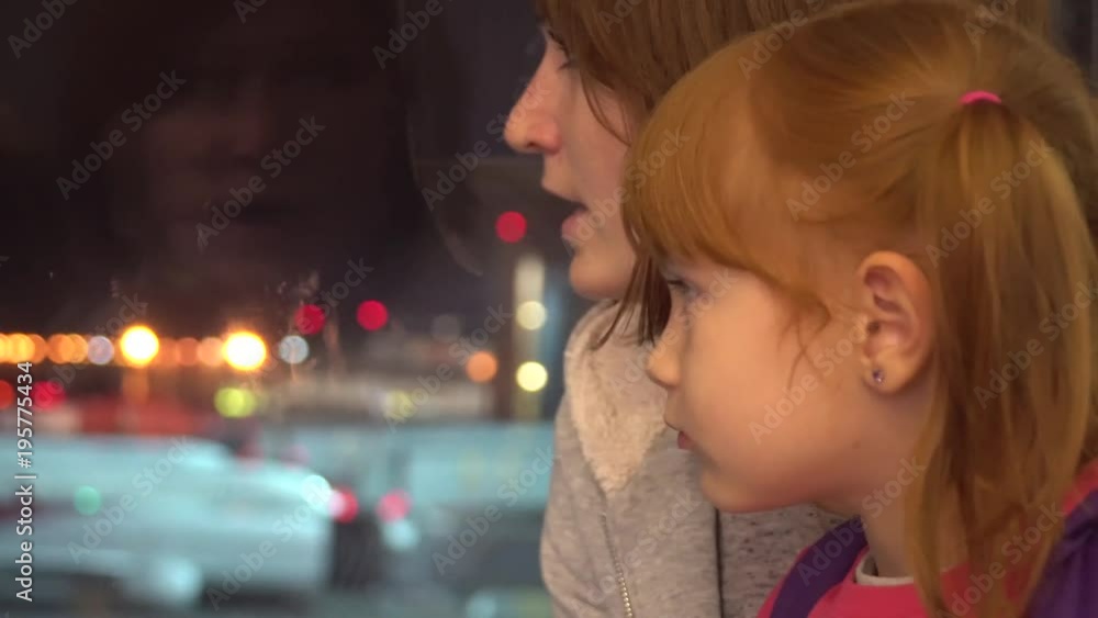 A little girl with mom looks at the airplanes at the airport. A little girl with mom looks at the airplanes at the airport.