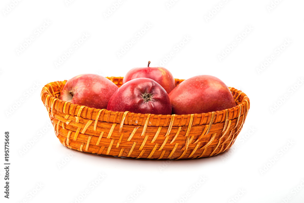 many apples in the basket close up on a white many apples in the basket close up on a white