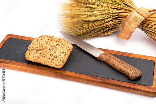 fresh bread and wheat on a white background