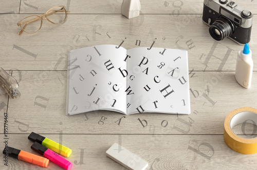 Open notebook with letters on it