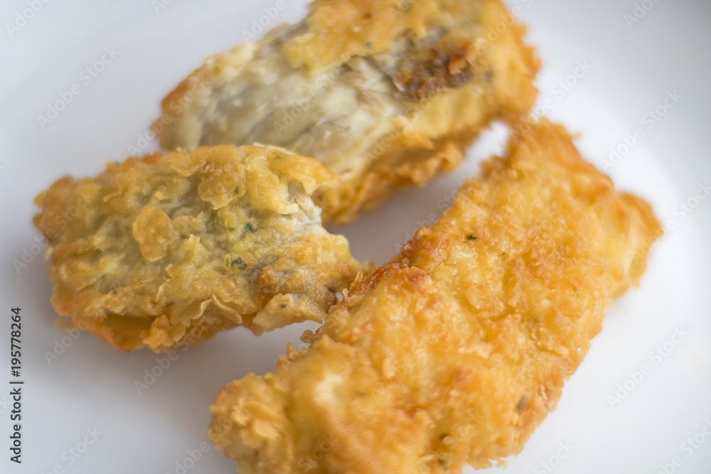 Two fried fish fillets.