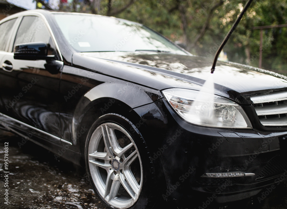 Car wash with pressurized water, car detailing (or valeting) concept.