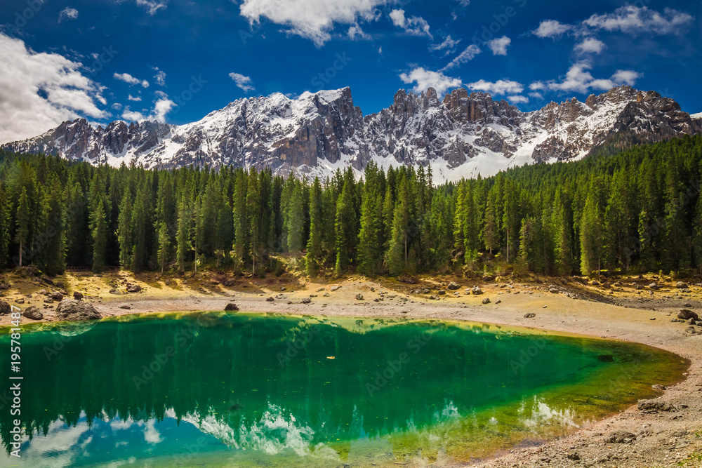 Green Carezza lake in Dolomites, Italy, Europe