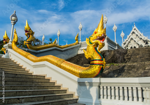 The staircase of the central entrance in Buddha Temple Kaeo Ko Wararam with dragons. Location: Krabi, Thailand. Artistic picture. Beauty world. © olenatur
