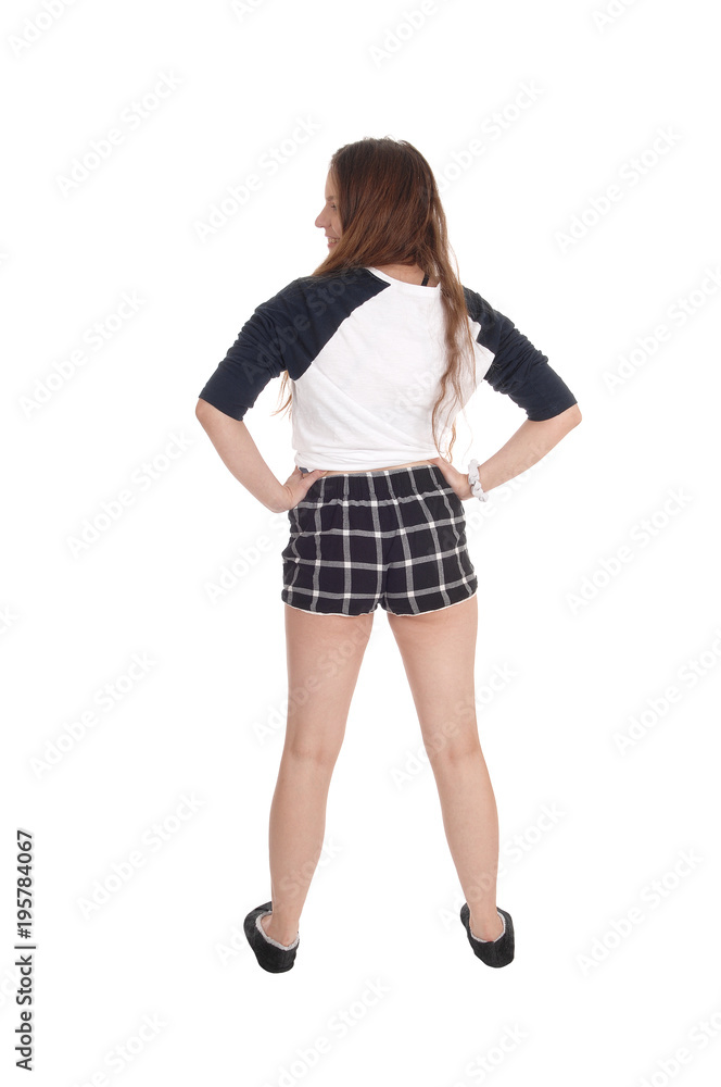 Woman standing in checkered shorts from the back Woman standing in checkered shorts from the back