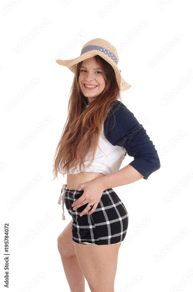 Beautiful woman with a straw hat and black shorts Beautiful woman with a straw hat and black shorts