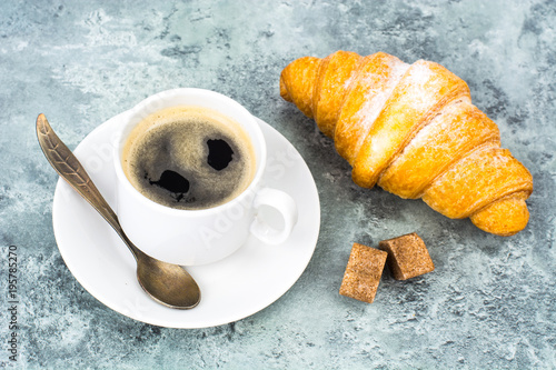 Aromatic hot coffee with croissant for breakfast. Studio Photo