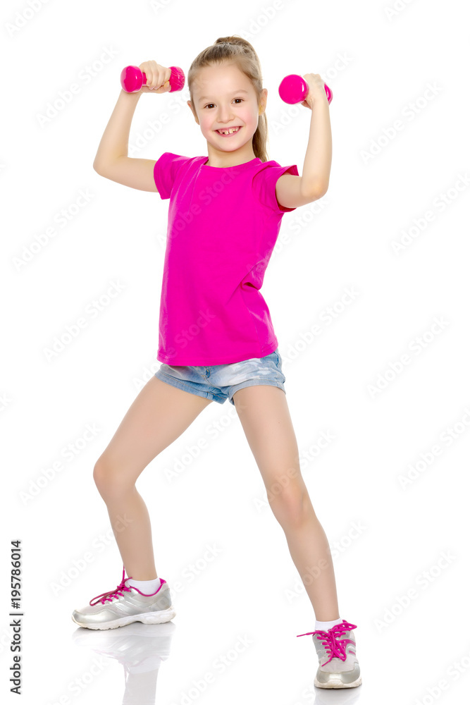 Little girl doing exercises with dumbbells. Little girl doing exercises with dumbbells.