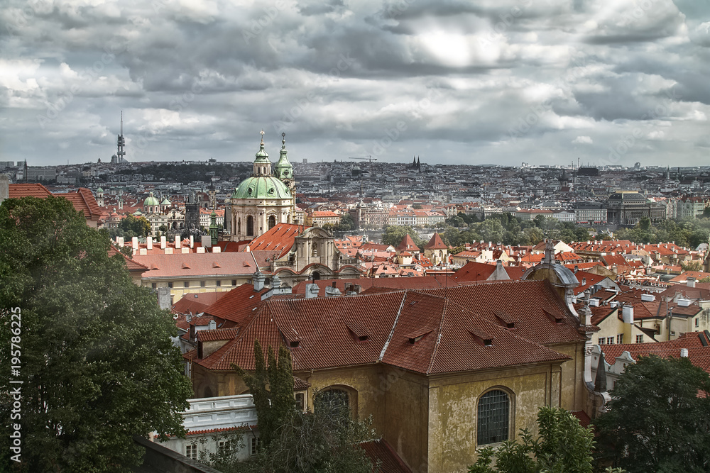 Roofs of Prague - a view of the church of St. Nicholas in Malostransky district of Prague.