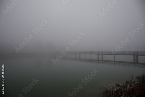 Wallpaper Mural Amazing landscape of bridge reflect on surface water of lake, fog evaporate from pond make romantic scene or Beautiful bridge on lake with trees at fog. Torontodigital.ca