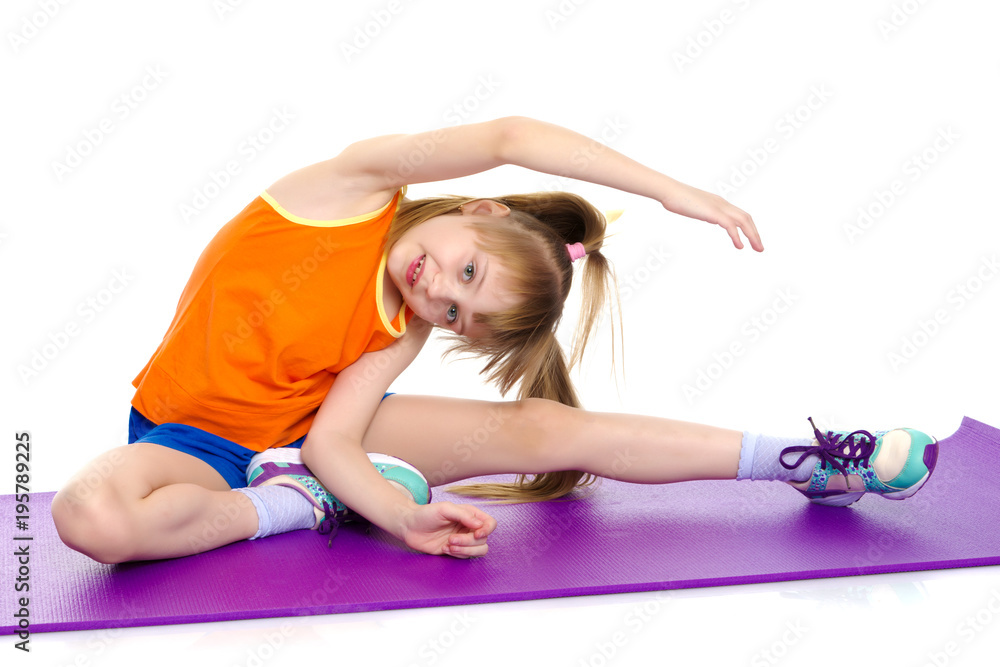 The gymnast perform an acrobatic element on the floor. The gymnast perform an acrobatic element on the floor.