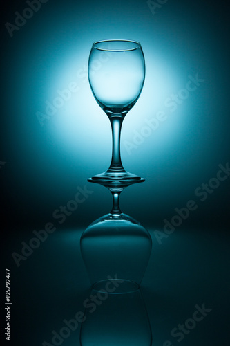Wine and cognac glasses on a blue graduated background