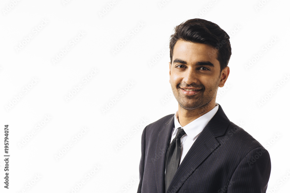 Happy businessman in suit and tie, isolated on white studio background Happy businessman in suit and tie, isolated on white studio background