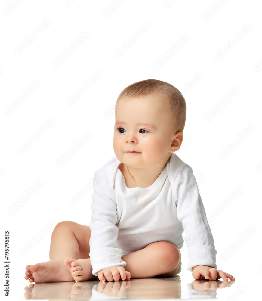 7 month infant child baby girl toddler sitting in white shirt looking at the corner 7 month infant child baby girl toddler sitting in white shirt looking at the corner