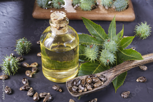 beans and castor oil on the black table