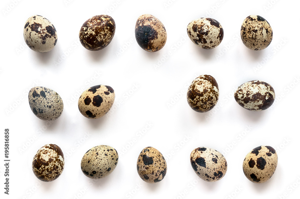 Isolated Quail Eggs On White Background. Copy space in center area. Top view. 