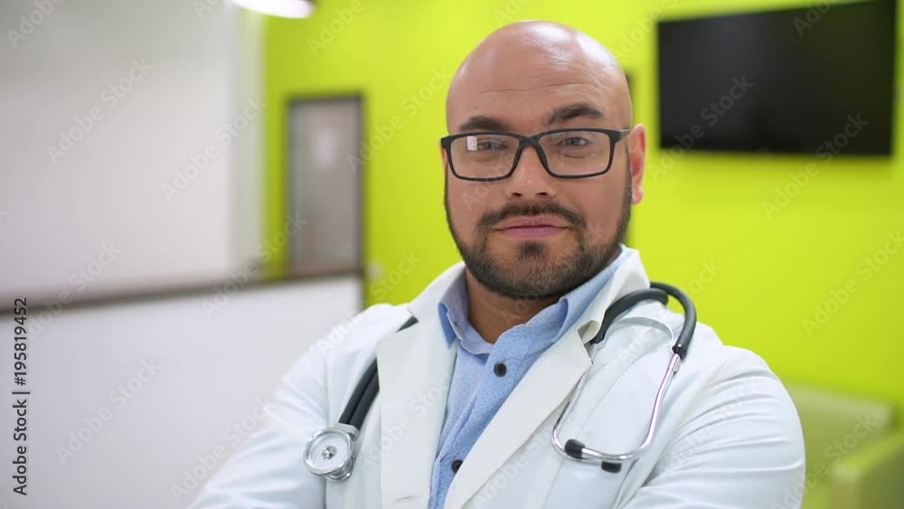 medicine, healthcare and people concept - portrait of happy smiling young male doctor showing thumbs up. slow-motion. Male doctor look at the camera. Clinician Man Show Thumb Up Sign Hand Gesture Look medicine, healthcare and people concept - portrait of happy smiling young male doctor showing thumbs up. slow-motion. Male doctor look at the camera. Clinician Man Show Thumb Up Sign Hand Gesture Look