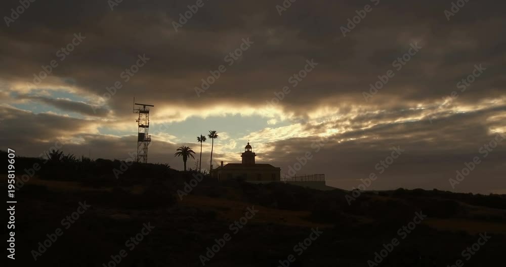 lighthouse in the coastline of Ponta da Piedade, Lagos Portugal, over the atlantic ocean lighthouse in the coastline of Ponta da Piedade, Lagos Portugal, over the atlantic ocean
