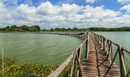 Wooden bridge across reservoir. © Freely