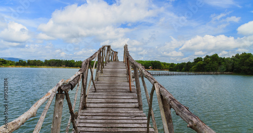 Wooden bridge across reservoir. © Freely