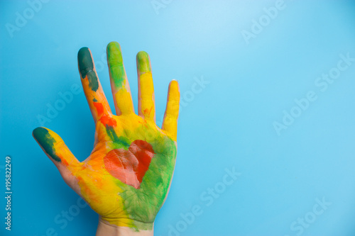 hand in colorful paint