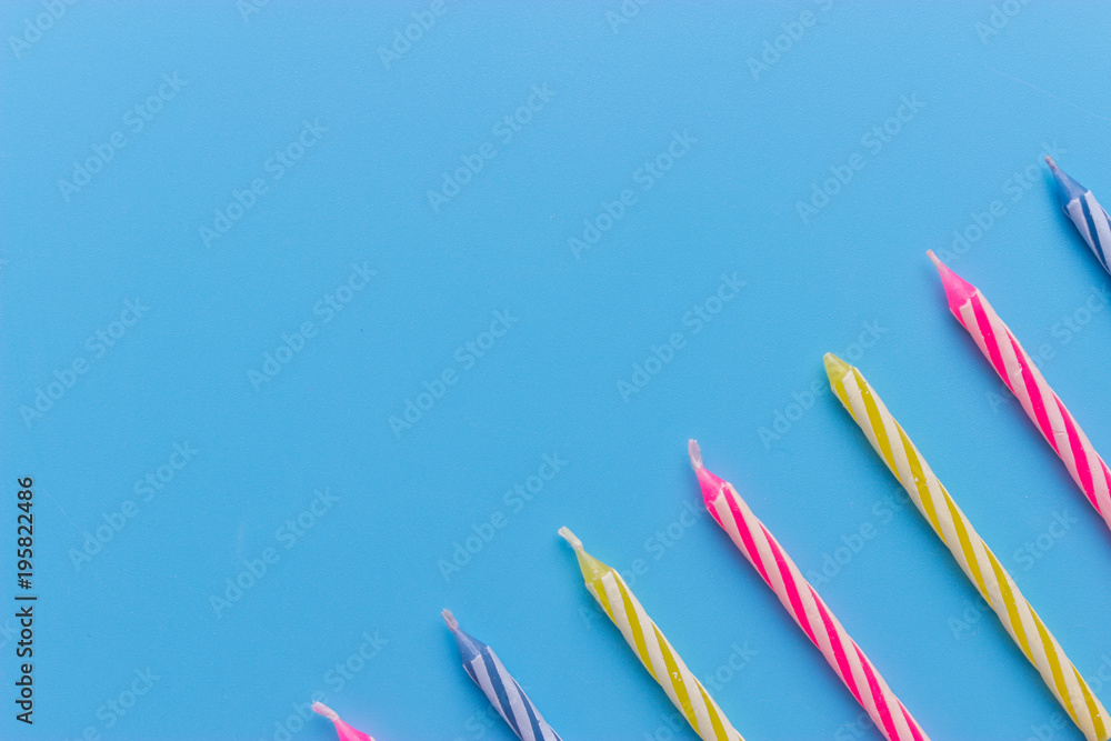 Birthday candles on blue background Stock Photo | Adobe Stock