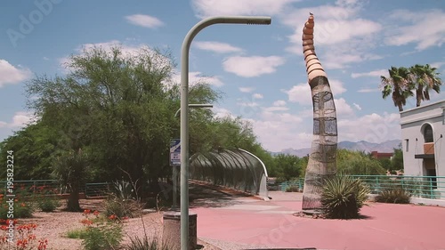Pedestrian bridge in the shape of a rattlesnake — including a tail with rattles. Walking or riding bicycles into the open jaws is an experience.