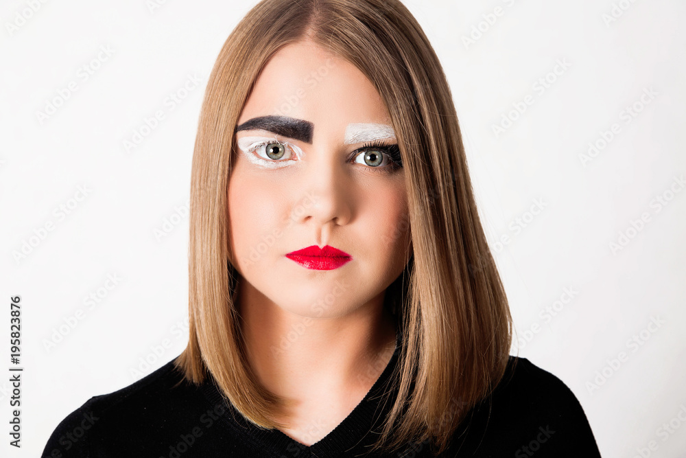 Fototapeta premium girl model with a short haircut and black and white eyebrows.
