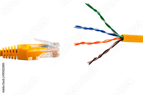An ethernet wire cable and yellow patch-cord with twisted pair. Isolated 