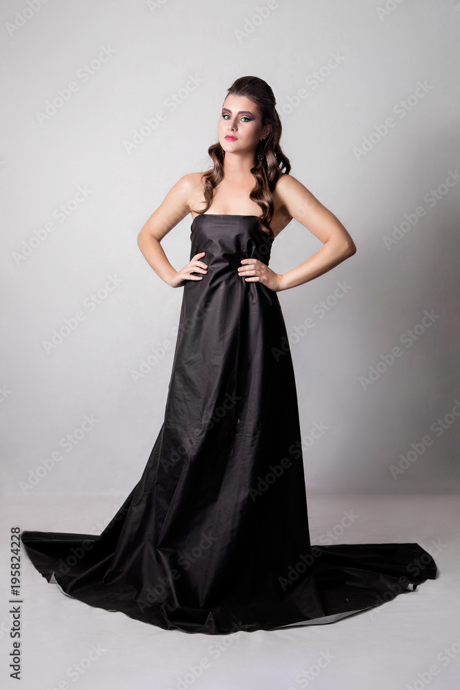 beautiful girl with fashion make-up and hairstyle in a long blac beautiful girl with fashion make-up and hairstyle in a long blac