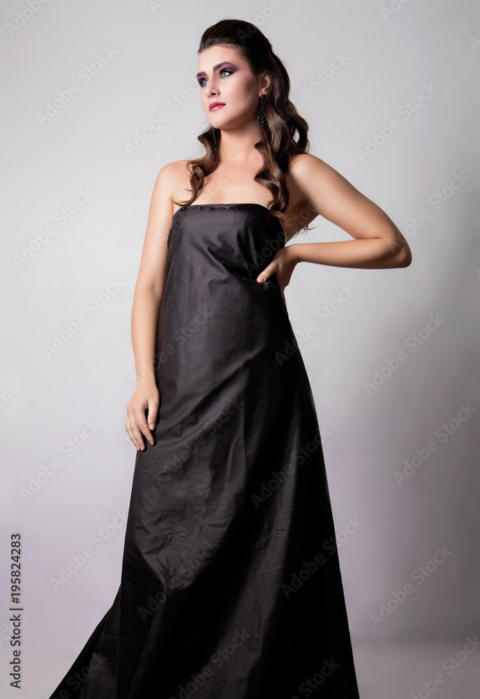beautiful girl with fashion make-up and hairstyle in a long blac beautiful girl with fashion make-up and hairstyle in a long blac
