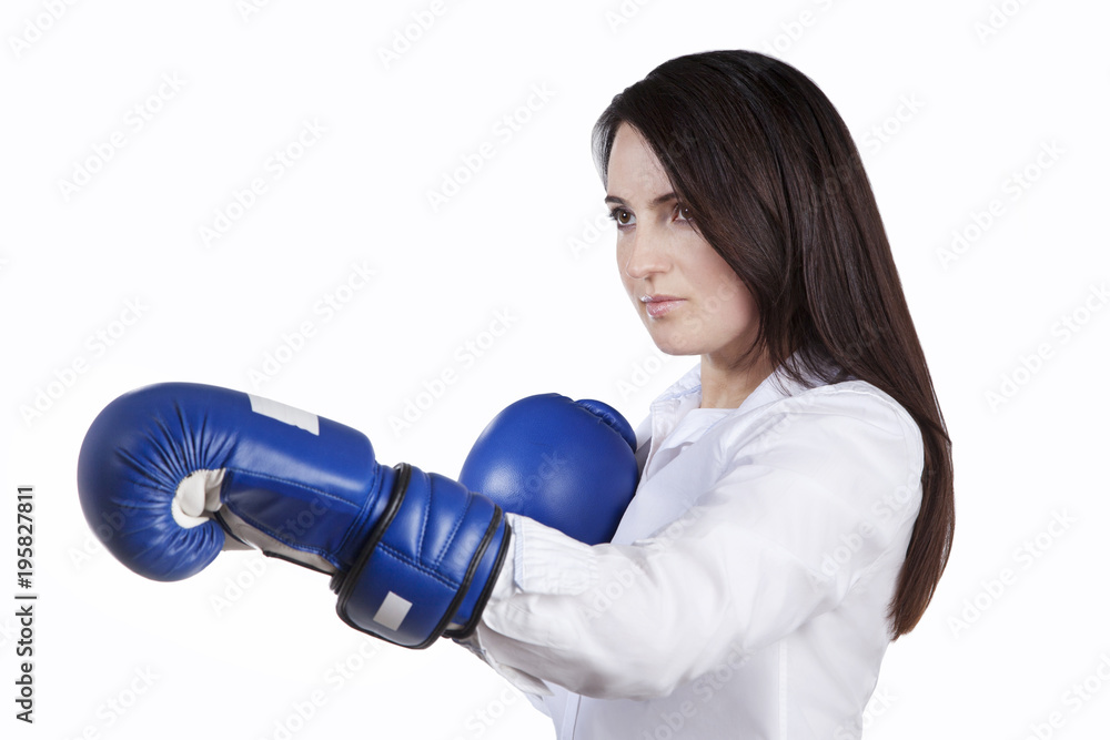 Confident woman in boxing perchitkah. Side view. Isolated on white background