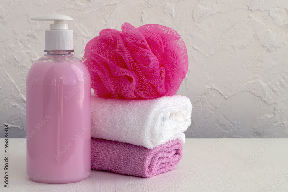 Liquid soap and two towels on a white background. Liquid soap and two towels on a white background.