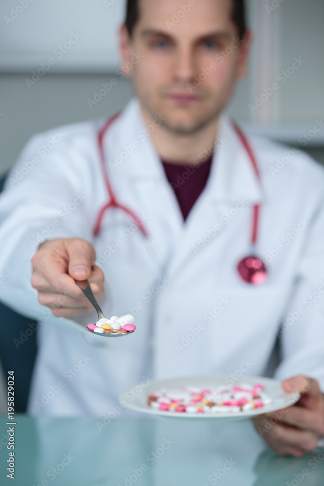 doctor giving pills on a dish doctor giving pills on a dish