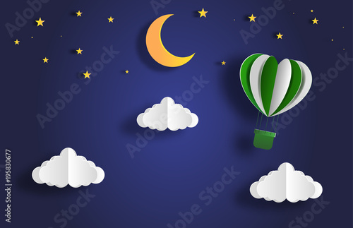Paper art style of landscape at night with hot air balloon on sky, full moon and stars, flat-style vector illustration.