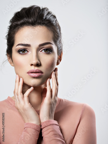 Portrait of an young beautiful  woman with  smoky eyes makeup.