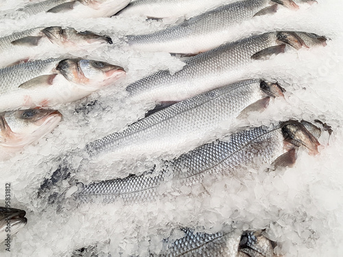 Fresh fish on ice in a supermarket for sale.