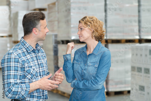 woman and man during warehouse invertory management