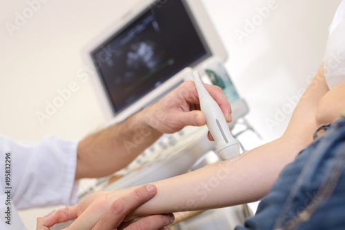 female arm getting treated by ultrasound laser equipment