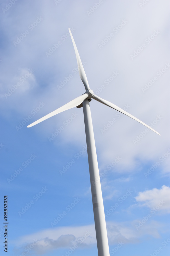 Wind turbines on a sunny day with a blue sky in Kassel, Germany Wind turbines on a sunny day with a blue sky in Kassel, Germany