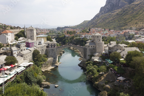 View from the top of the city of Mostar and its famous bridge in a sunny day in summer season